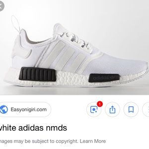 White and black adidas nmd tennis shoes